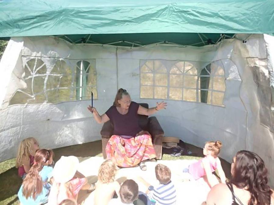 Ruth storytelling to group of children